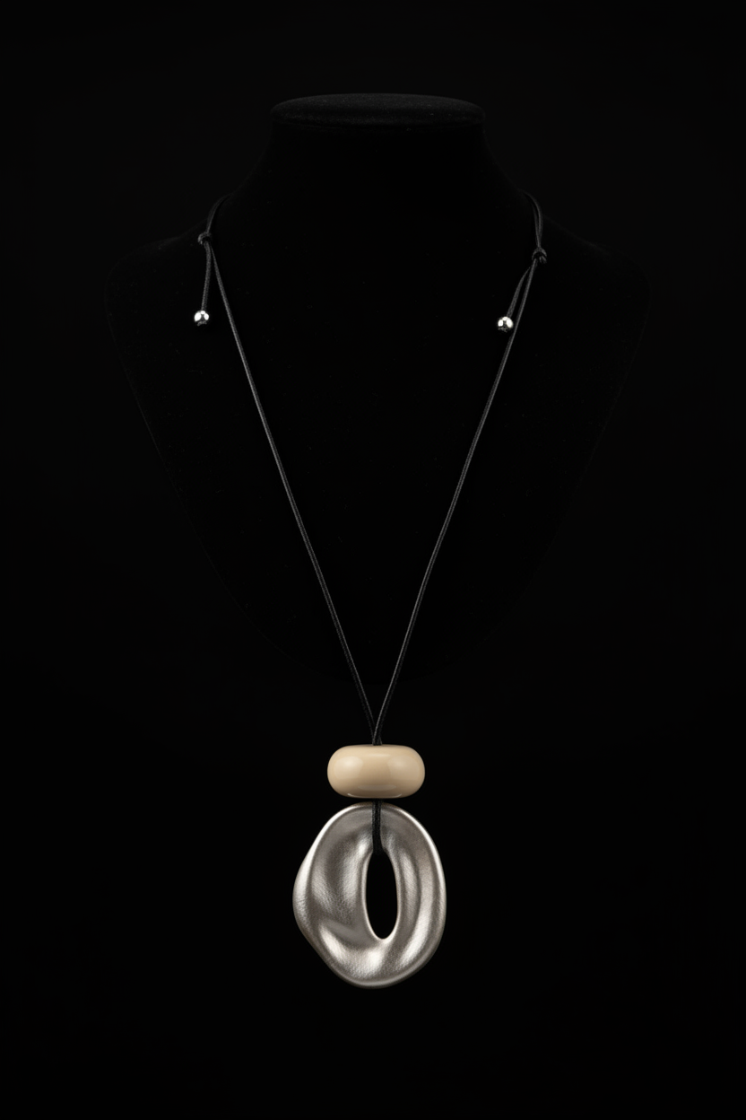 Black background pearlescent oval pendant black cord necklace
