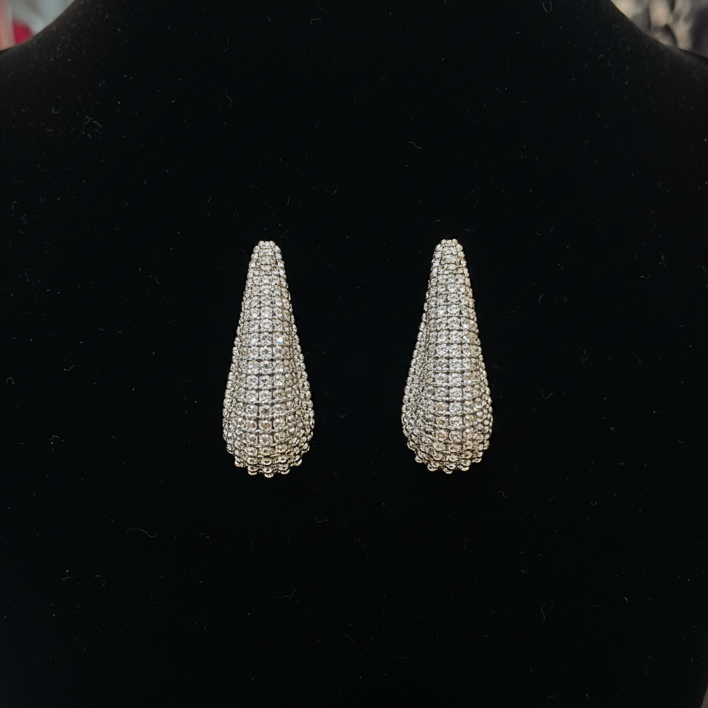 Black background silver bead cone teardrop earrings