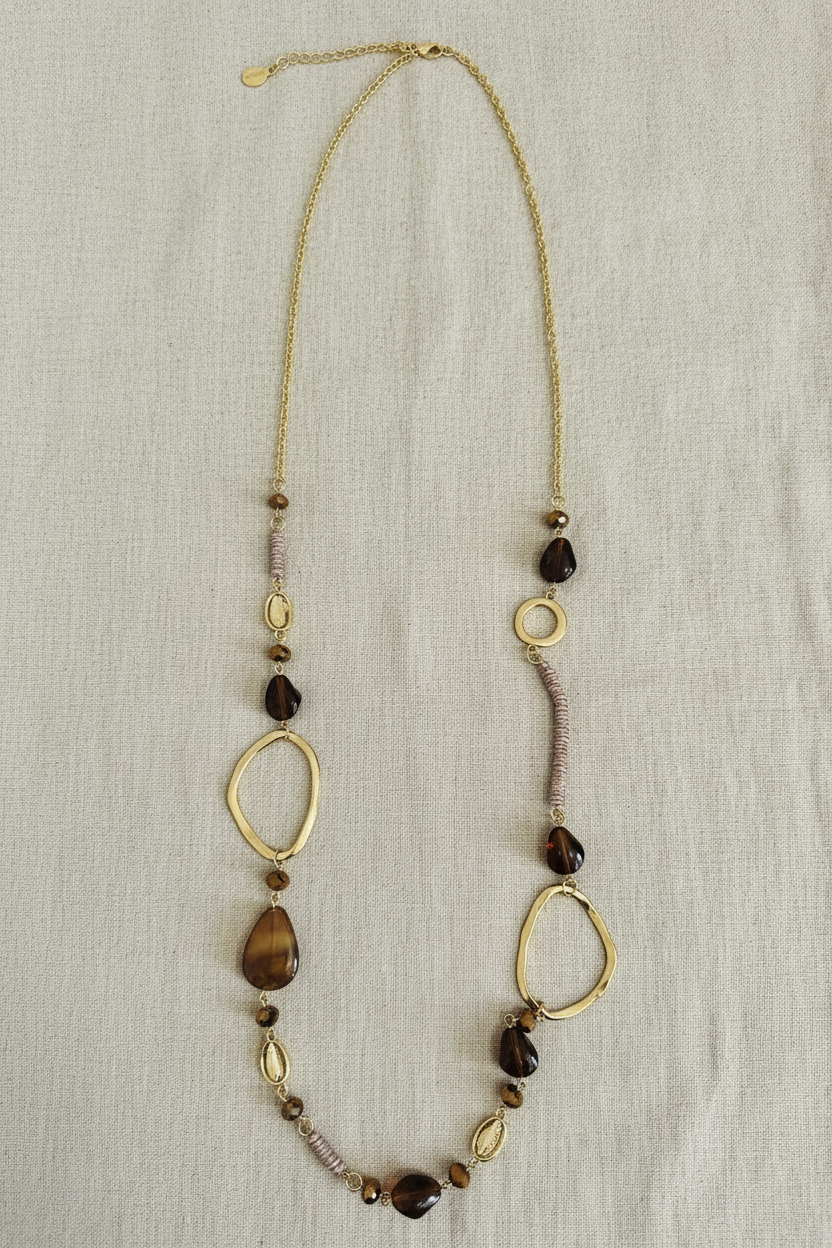 Brown stone necklace warm linen flat lay