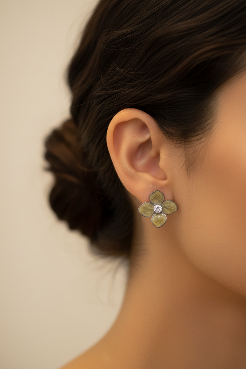 Close-up ear shot olive marbled flower crystal stud earring