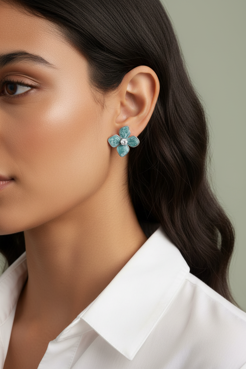 Close-up ear shot teal marbled flower stud earring