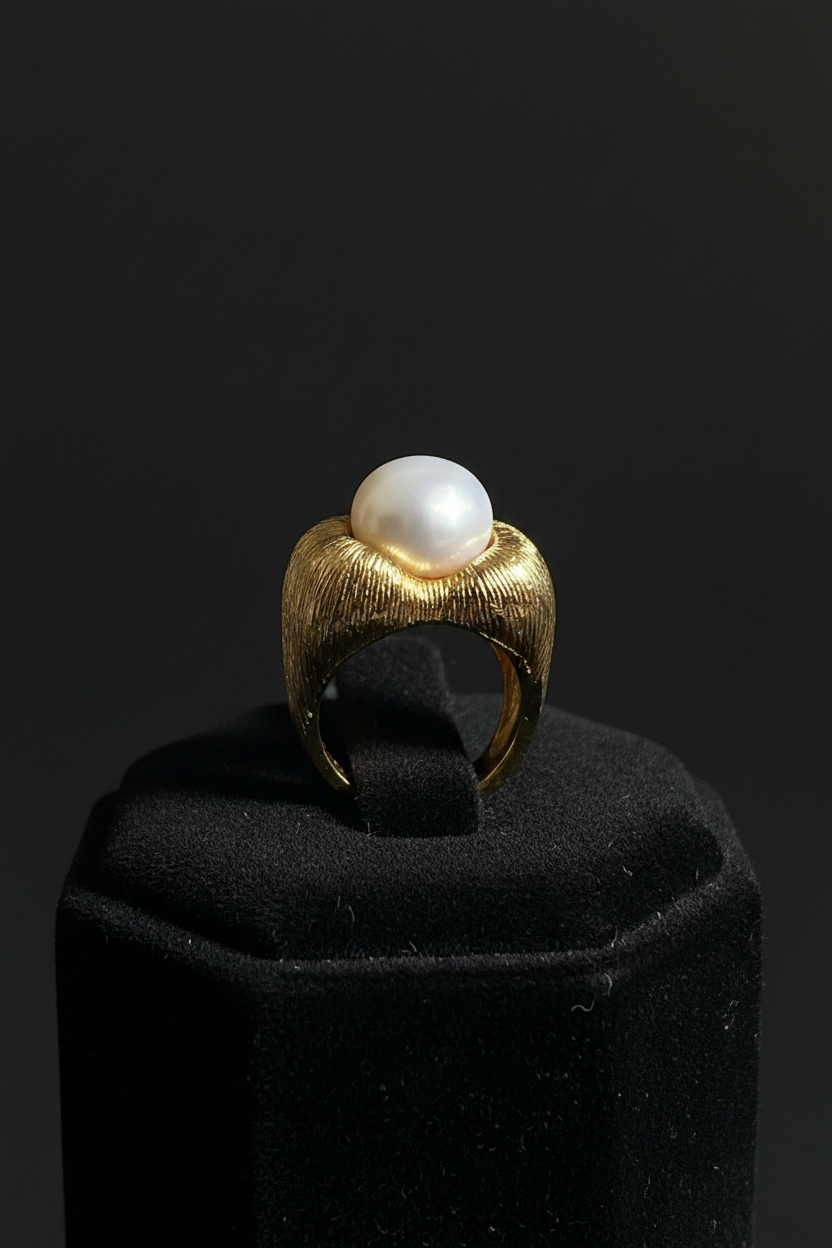 Display shot gold pearl sculptural ring
