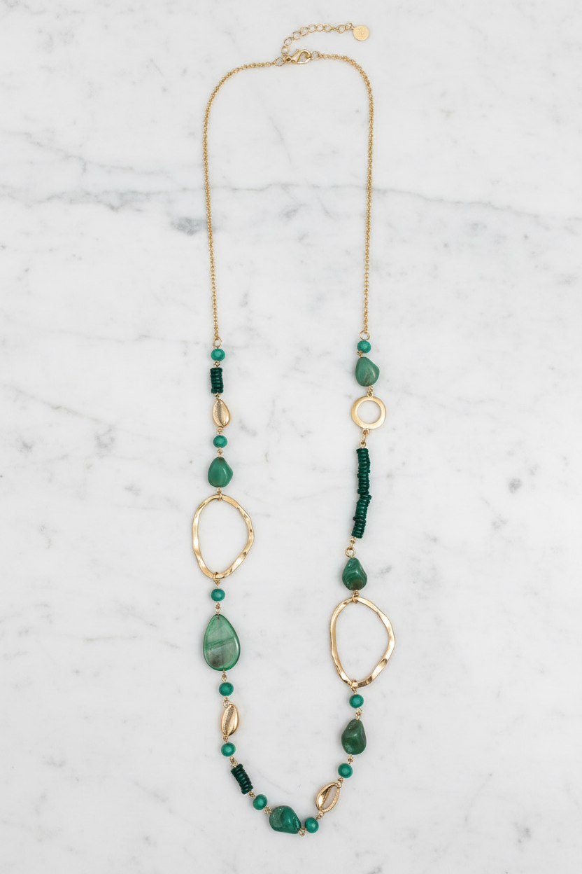 Emerald necklace light background flat lay
