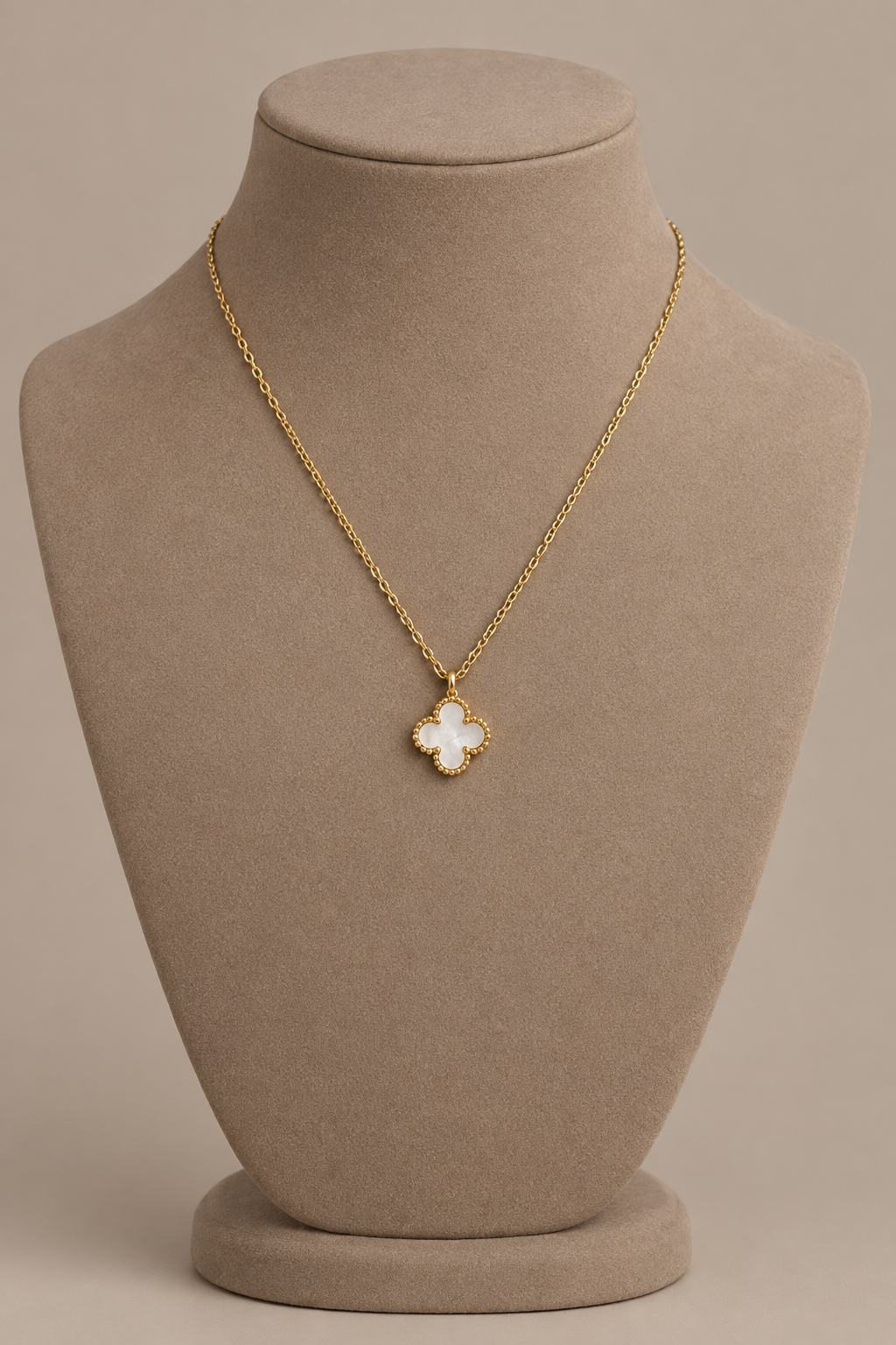 Erin White Clover Necklace on display