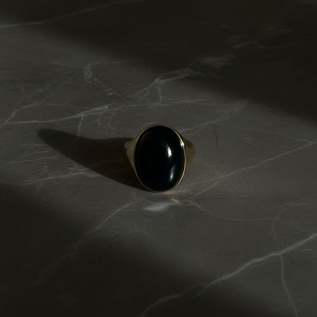 Flat lay black onyx gold ring