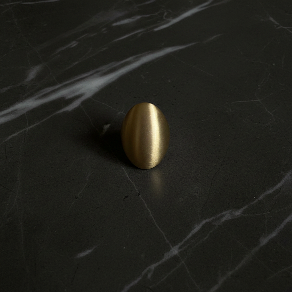 Flat lay gold egg dome ring