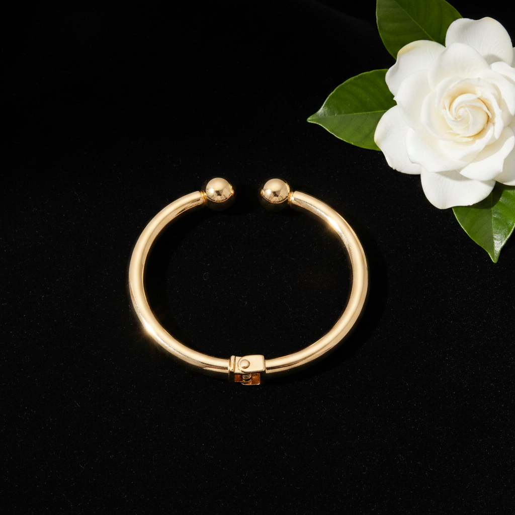 Gold ball cuff elegant flat lay