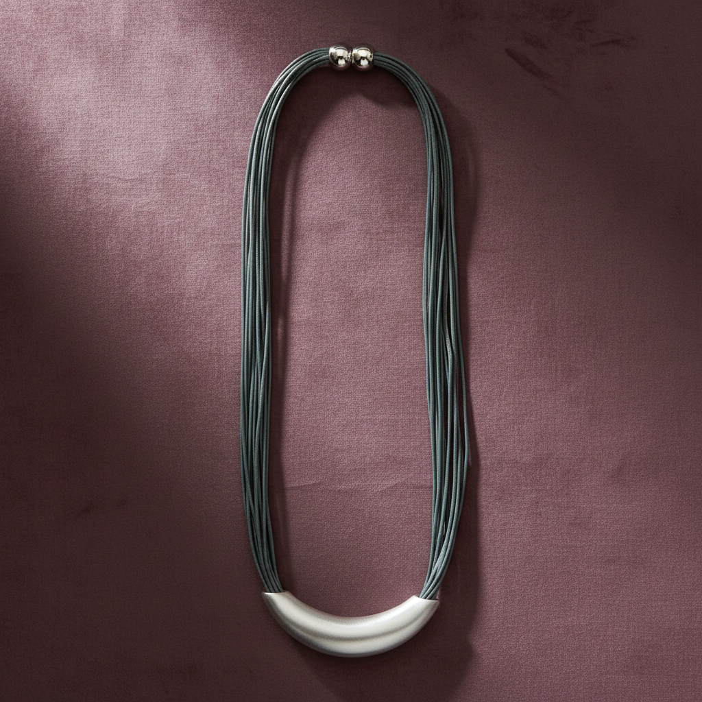 Zen Grey Cord Silver Arc Necklace – mauve background flat lay