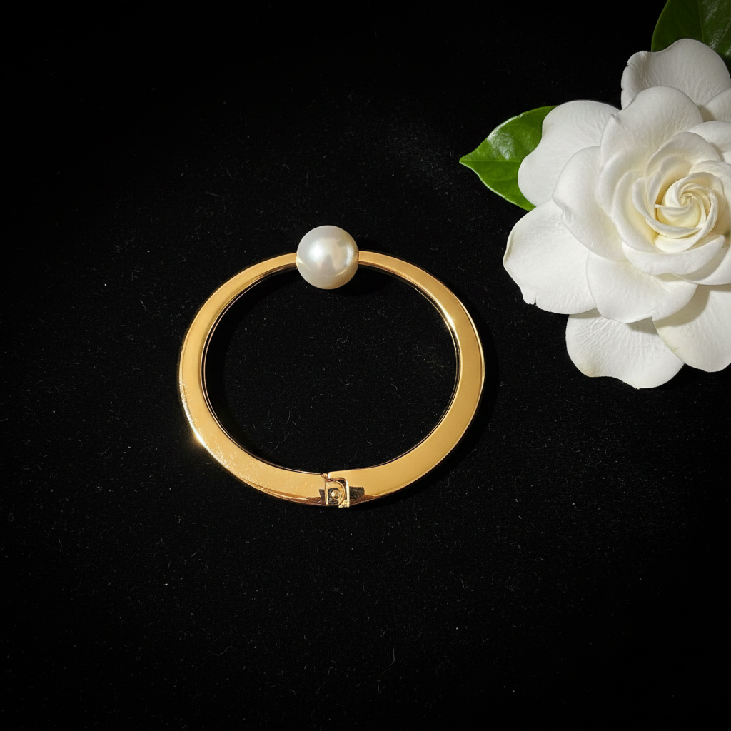 Pearl gold bangle flat lay