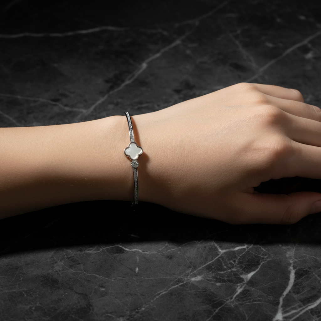 Silver bracelet on model dark marble