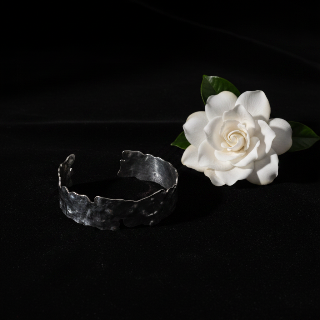 Silver molten cuff flat lay