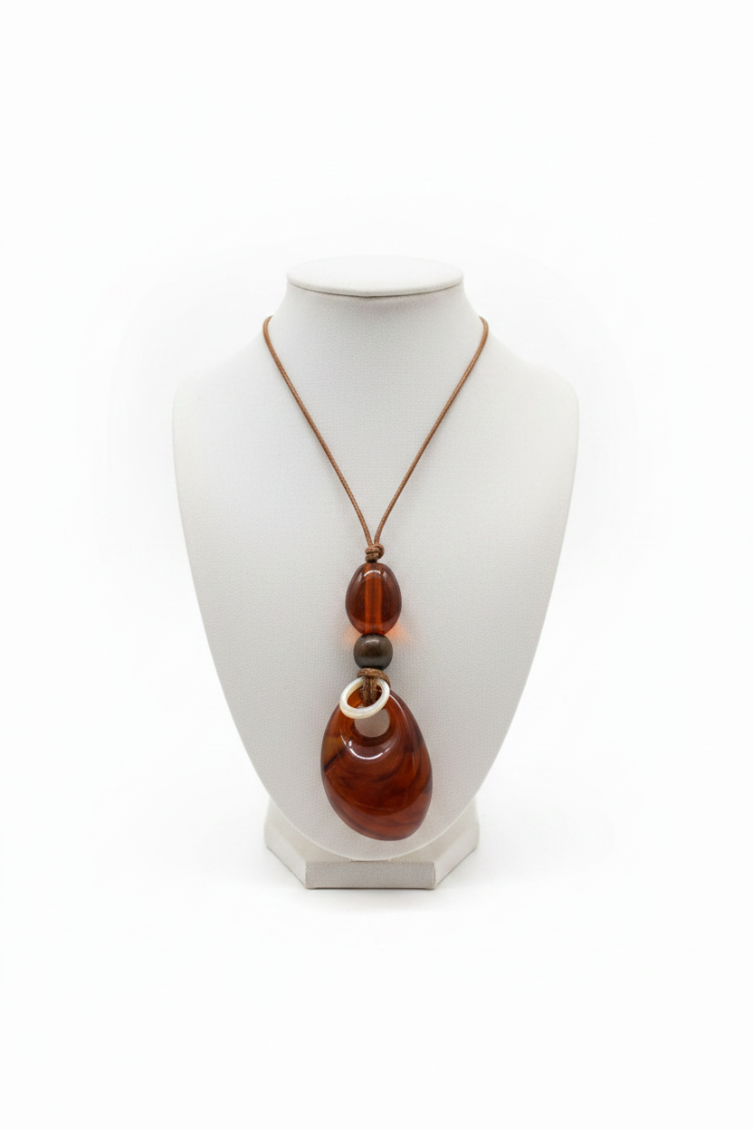 White background amber resin teardrop pendant necklace detail