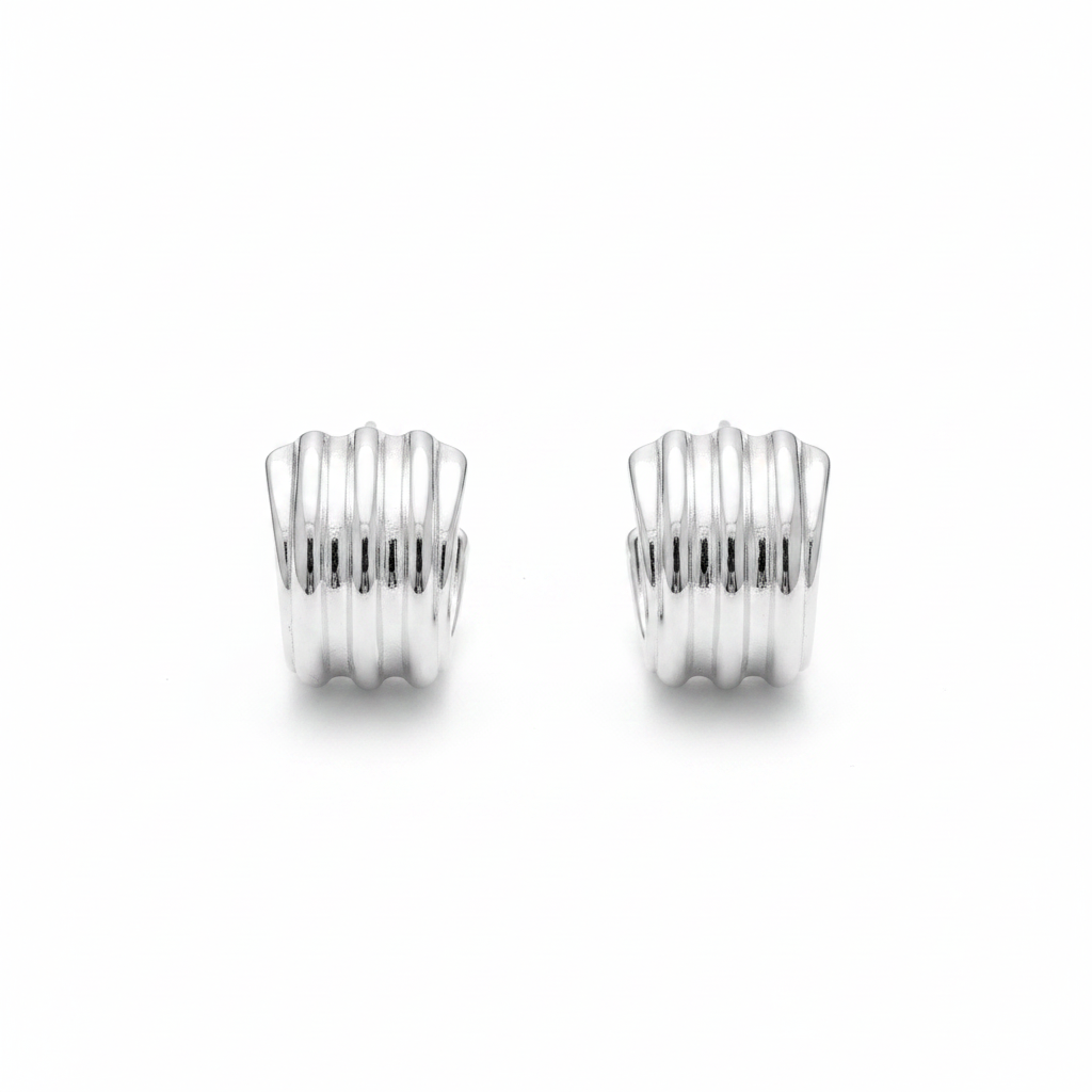 White background chunky ribbed silver huggie hoops